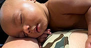 Tyrone joined the competition — help win amazing prizes! arm, baby, camouflage, child, closeup, clothing, cute, face, human, indoors, infant, napping, peaceful, person, portrait, relaxation, rest, skin, sleeping, soft_light