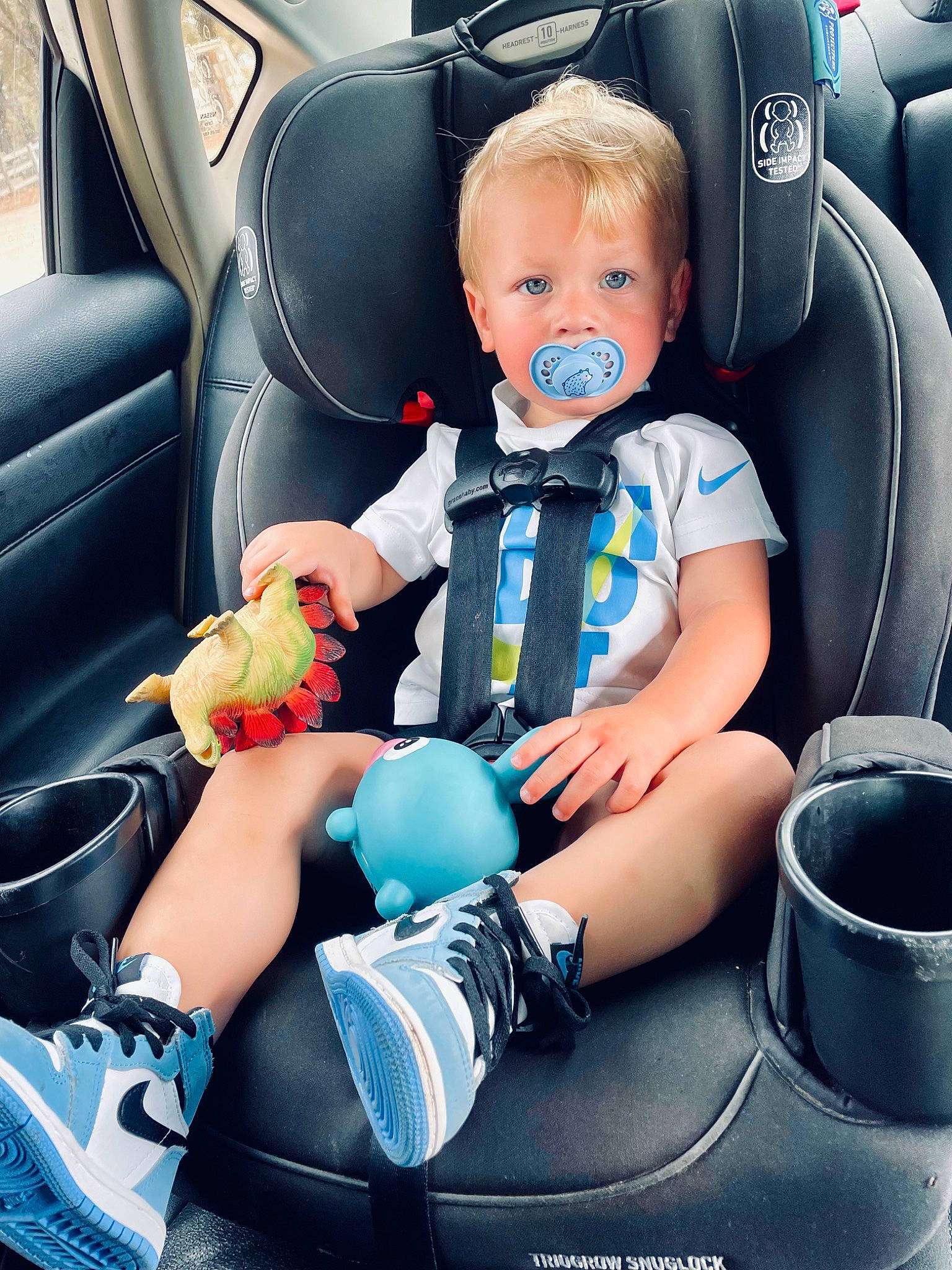 Branson joined the competition — help win amazing prizes! auto_part, automotive_design, automotive_exterior, car, car_seat, car_seat_cover, child, comfort, electric_blue, family_car, flash_photography, head_restraint, luxury_vehicle, motor_vehicle, person, seat_belt, sneakers, steering_wheel, thigh, toddler