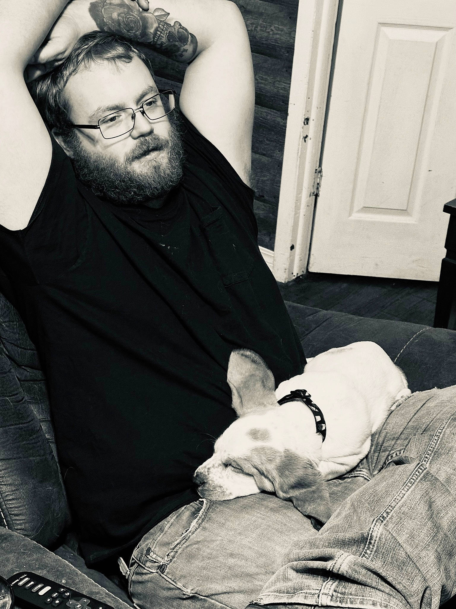 Buster is registered to the contest to win money with this photo: beard, black, black_and_white, comfort, cool, door, elbow, eyewear, facial_hair, flash_photography, gesture, glasses, hairstyle, human, muscle, organ, photograph, style, vision_care, white