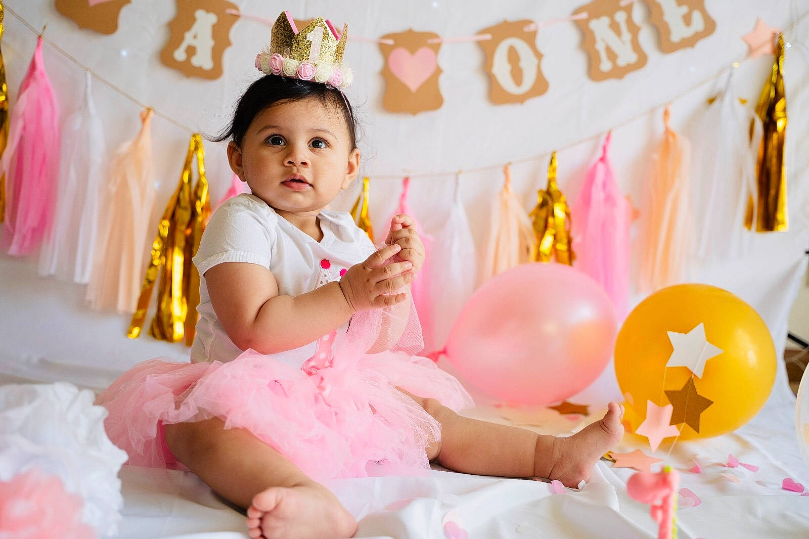 Inaaya is registered to the contest to win money with this photo: baby, baby_toddler_clothing, beauty, child, dress, event, fashion, fun, happy, leisure, lighting, party_supply, people, person, pink, product, skin, textile, toddler, white