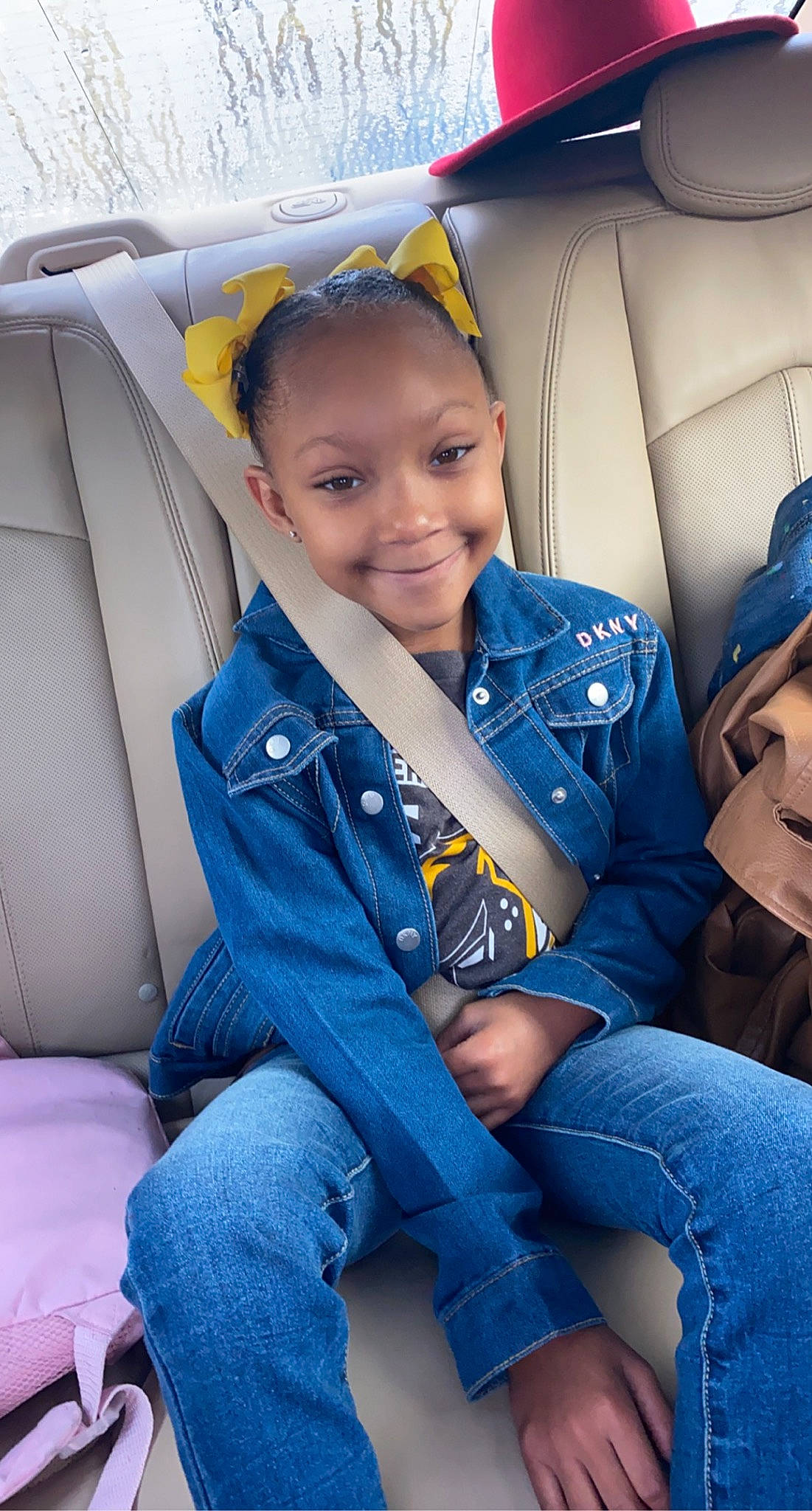 Aleena is registered to the contest to win money with this photo: auto_part, car_seat, child, denim, family_car, jeans, joy, person, seat_belt, sitting, textile, toddler