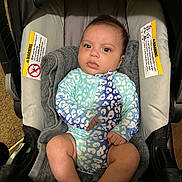 Genesis joined the competition — help win amazing prizes! baby, child, car_seat, onesie, blanket, indoor, infant, person, seat, clothing, cute, face, legs, feet, expression, young, newborn, comfort, looking, portrait