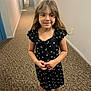 Kennedi joined the competition — help win amazing prizes! child, girl, smiling, black_dress, white_sandals, hallway, carpet, long_hallway, door, lighting, person, standing, indoor, young, happy, clothing, portrait, hair, wall, floor