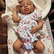 Sapphire joined the competition — help win amazing prizes! baby, sleeping, infant, floral_outfit, headband, socks, blanket, crib, wooden_crib, cozy, peaceful, cute, child, indoor, resting, soft_texture, toddler, person, laying_down, adorable
