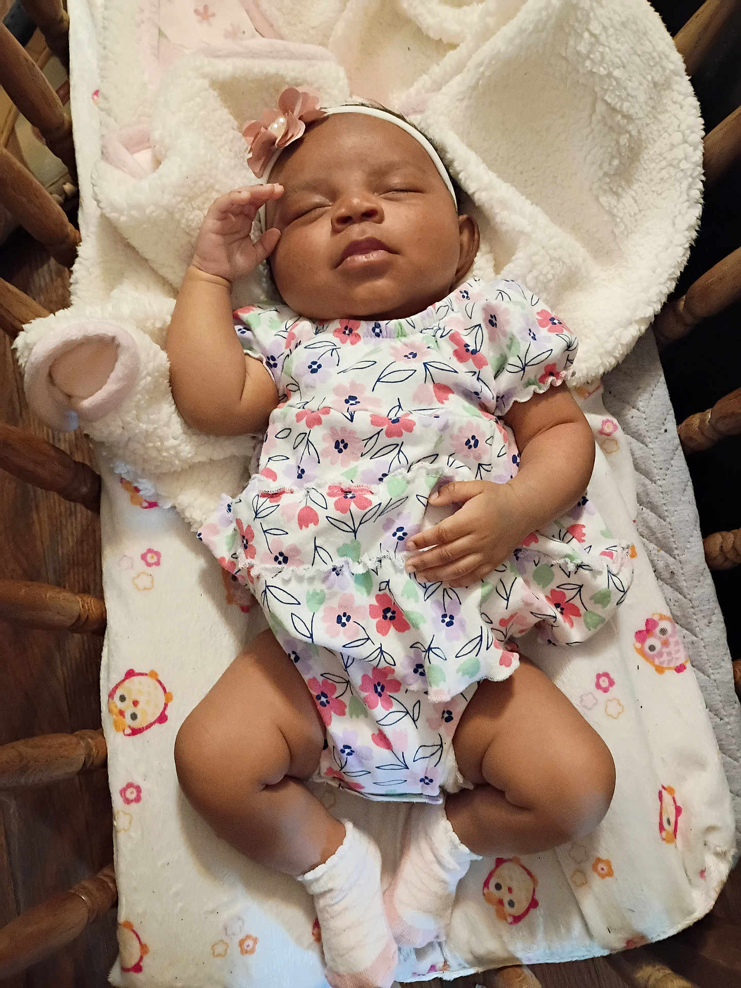 Sapphire joined the competition — help win amazing prizes! baby, sleeping, infant, floral_outfit, headband, socks, blanket, crib, wooden_crib, cozy, peaceful, cute, child, indoor, resting, soft_texture, toddler, person, laying_down, adorable