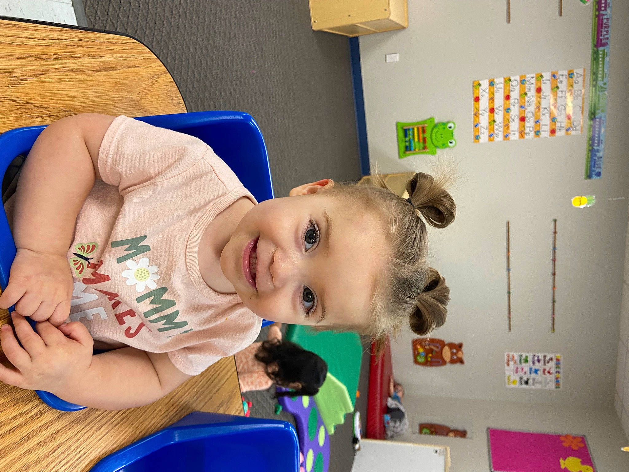 Arya is registered to the contest to win money with this photo: baby, baby_products, baby_toddler_clothing, baby_toys, blue, child, flooring, fun, happy, joy, kindergarten, leisure, person, play, room, sitting, smile, toddler, wood