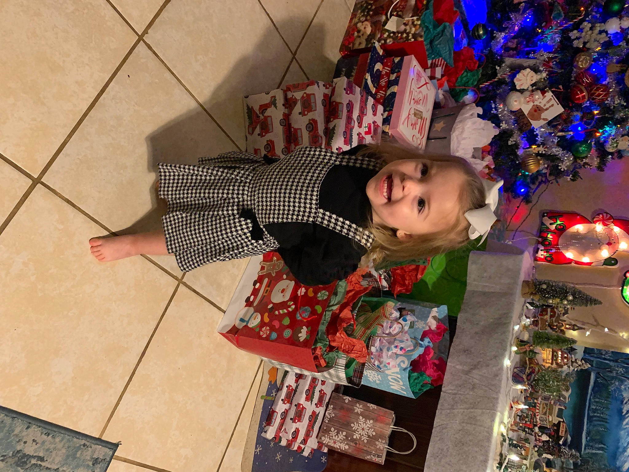 Arya joined the competition — help win amazing prizes! child, christmas, christmas_decoration, christmas_eve, christmas_ornament, event, flooring, fun, happy, hardwood, holiday, holiday_ornament, ornament, pattern, person, room, smile, temple, toddler, tradition