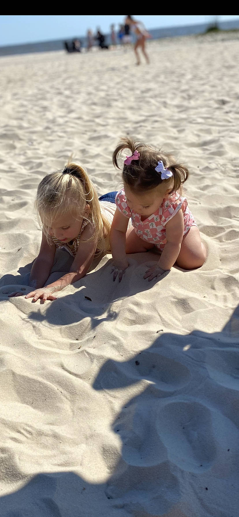 Mckenzie joined the competition — help win amazing prizes! aeolian_landform, arm, baby, beach, child, fun, happy, head, human_body, landscape, leisure, people_in_nature, people_on_beach, person, recreation, sand, shadow, singing_sand, sitting, sunglasses