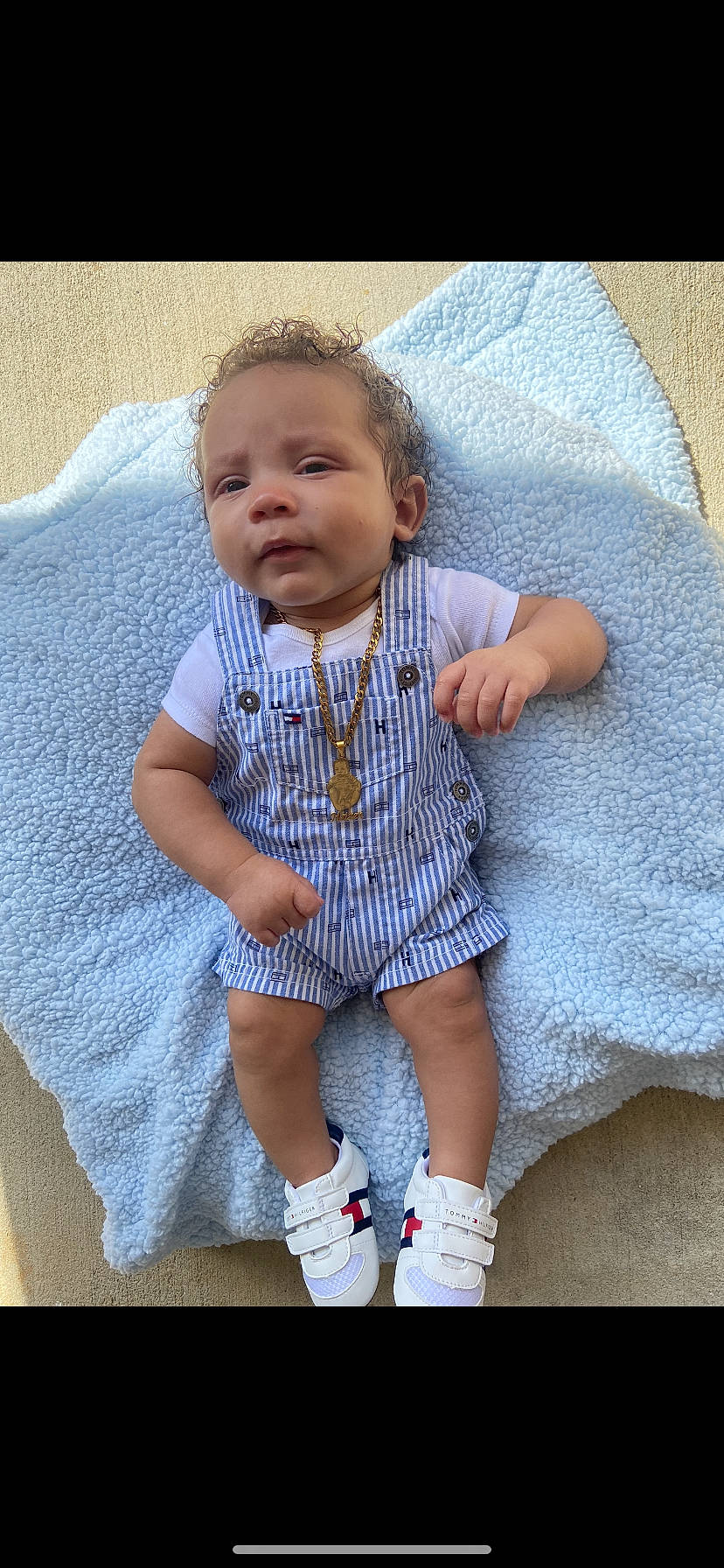 Haizen is registered to the contest to win money with this photo: azure, baby, baby_products, baby_toddler_clothing, cheek, child, comfort, electric_blue, face, happy, linens, pattern, person, pink, product, purple, sitting, sleeve, t_shirt, textile