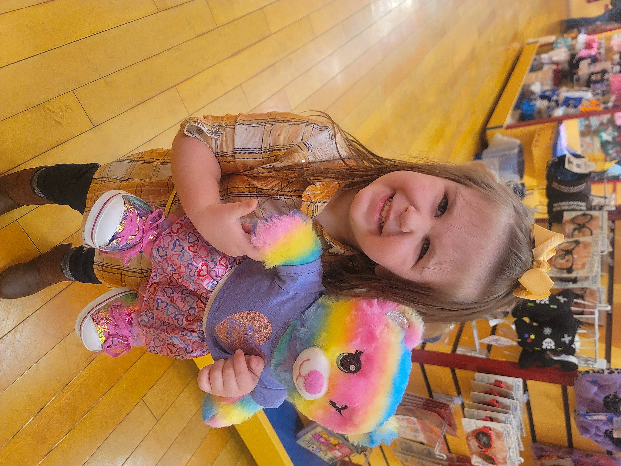 Tessa is registered to the contest to win money with this photo: art, child, doll, flooring, fun, happy, hardwood, joy, leisure, person, play, room, smile, stuffed_toy, toddler, toy, wood, wood_flooring, wood_stain