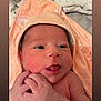newborn, baby, infant, face, tongue, hands, peach_towel, hood, cute, skin, expression, closeup, child, portrait, soft, blanket, indoors, sleepwear, newborn_baby, adorable