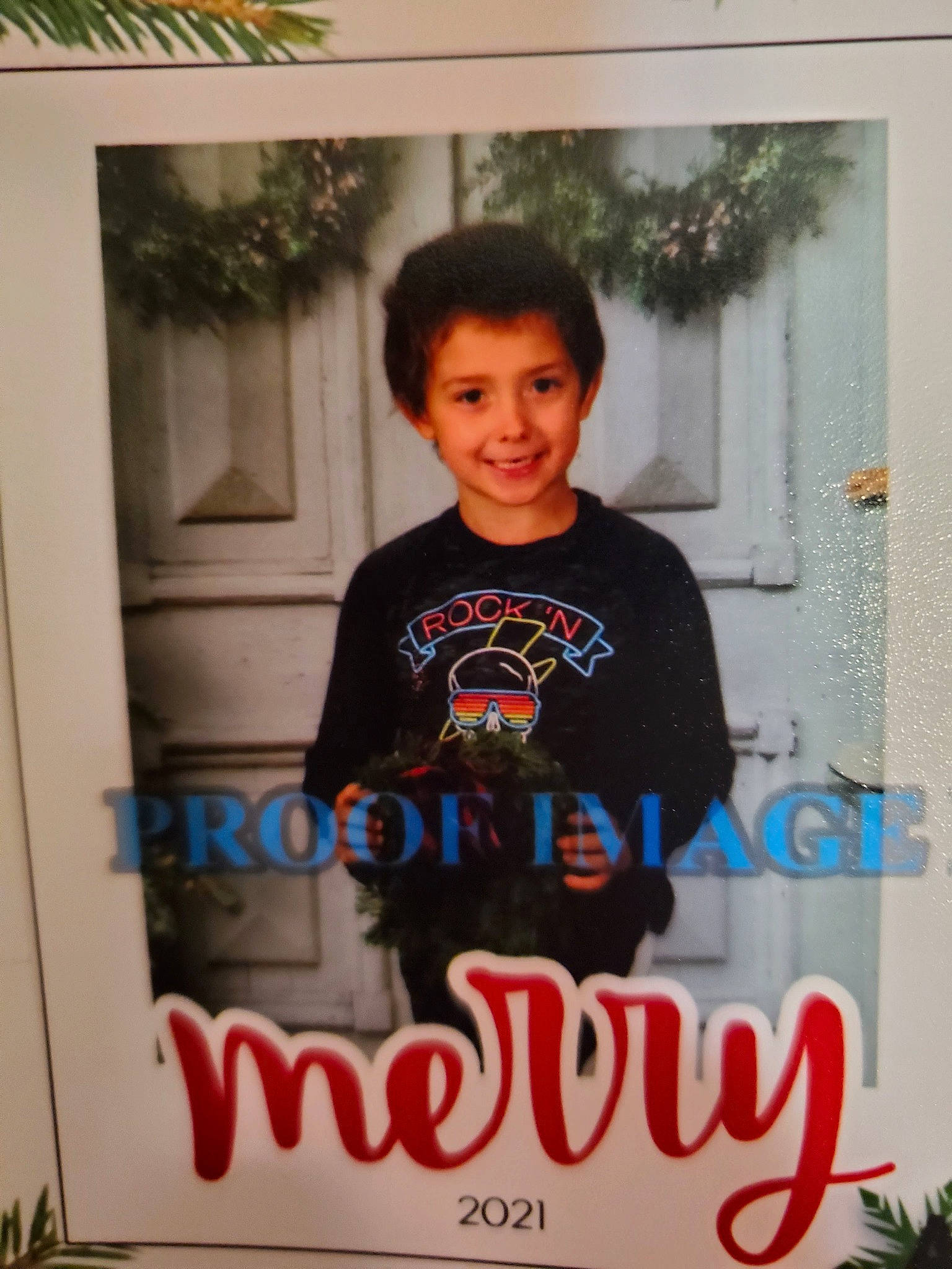 Braxton is registered to the contest to win money with this photo: advertising, child, font, fun, happy, joy, logo, person, photo_caption, plant, room, sleeve, smile, t_shirt, toddler, top, tree