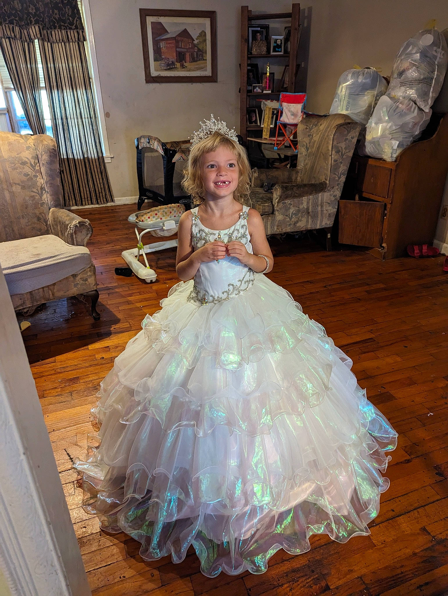 Grace-lynn joined the competition — help win amazing prizes! bridal_clothing, bridal_party_dress, couch, day_dress, dress, embellishment, face, fashion_design, flooring, gown, hair, happy, head, human_body, joy, person, picture_frame, smile, textile, toddler