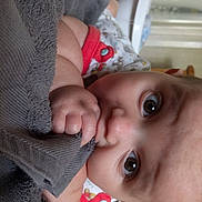 Flynn is registered to the contest to win money with this photo: baby, child, finger, hand, leg, lip, mouth, nose, toddler