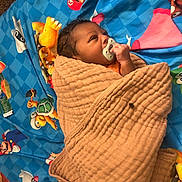 Kmarion joined the competition — help win amazing prizes! baby, blanket, pacifier, child, wrapped, bed, cartoon, character, mario, blue, brown, cute, infant, sleeping, face, hand, soft, comfort, toy, closeup