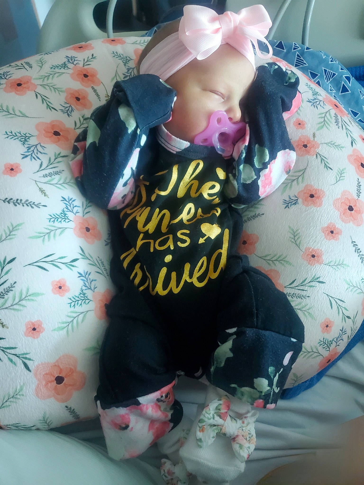 Serenity is registered to the contest to win money with this photo: baby, baby_products, baby_toddler_clothing, bag, bedding, car_seat, child, comfort, font, headwear, linens, pattern, person, pillow, pink, room, sitting, sleeve, stuffed_toy, t_shirt