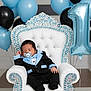 baby, sleeping, tuxedo, chair, balloons, number_balloon, birthday, celebration, blue, black, white, pacifier, jewels, throne, party, infant, cute, formal_wear, decor, indoors