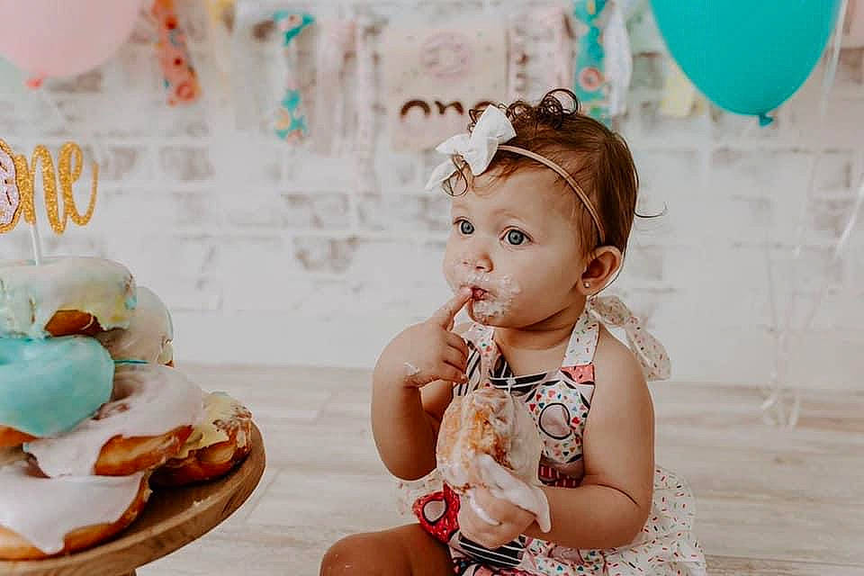 Ayva is registered to the contest to win money with this photo: baby, birthday, cake, child, dessert, fashion_accessory, food, hair_accessory, happy, headband, headgear, party, person, pink, sweetness, toddler