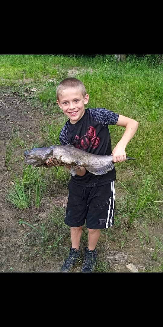 Jaydan joined the competition — help win amazing prizes! bermuda_shorts, boot, child, fish, fishing, grass, grassland, hunting, joy, people_in_nature, person, plant, ray_finned_fish, recreation, reptile, shorts, smile, soil, t_shirt, terrestrial_animal