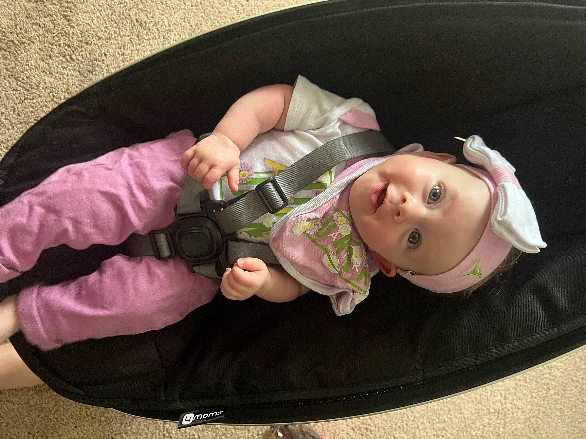 Josie Jane is registered to the contest to win money with this photo: auto_part, baby, baby_carriage, baby_products, baby_toddler_clothing, car_seat, child, comfort, doll, fashion_accessory, fun, grass, hat, headwear, lap, person, personal_protective_equipment, pink, sitting, toddler