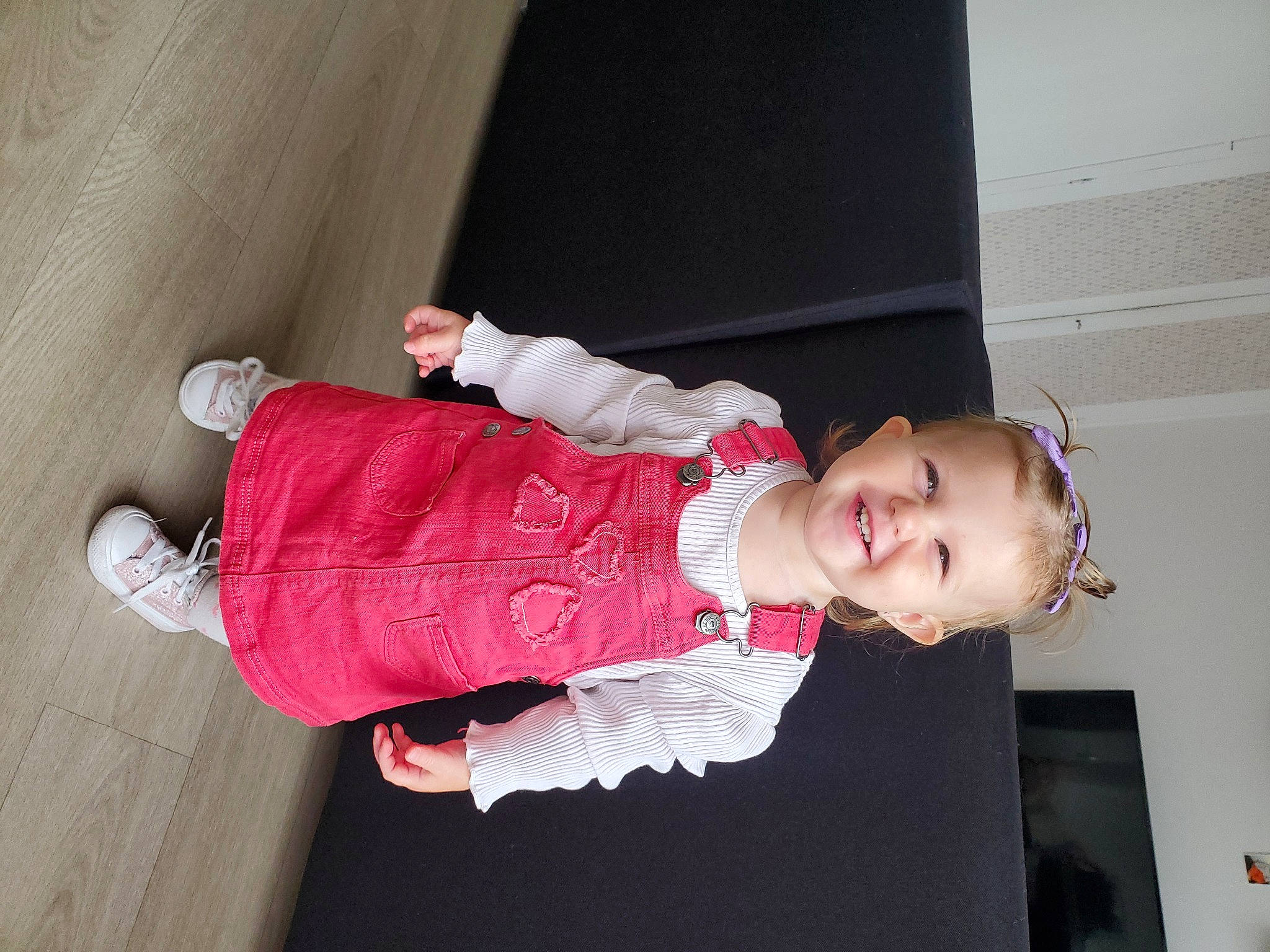 Nelya a rejoint le concours — aidez-le/la à gagner de superbes lots ! baby, baby_products, baby_toddler_clothing, child, flooring, fun, happy, hardwood, human_leg, joy, magenta, pattern, person, pink, sleeve, smile, toddler, wood