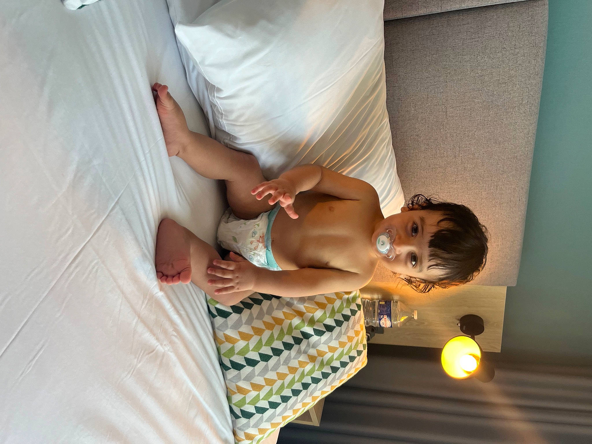 Amir participe au concours pour gagner de l'argent avec cette photo : abdomen, barechested, chest, child, comfort, dress, elbow, event, flooring, fun, human_body, human_leg, leg, linens, person, room, textile, thigh, toddler, trunk