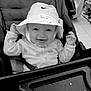 Hazel is registered to the contest to win money with this photo: baby, baby_clothes, bucket_hat, child, clothing, cute, face, happy, hat, headwear, indoor, infant, joyful, nike, person, seatbelt, shopping, smiling, stroller, young_child