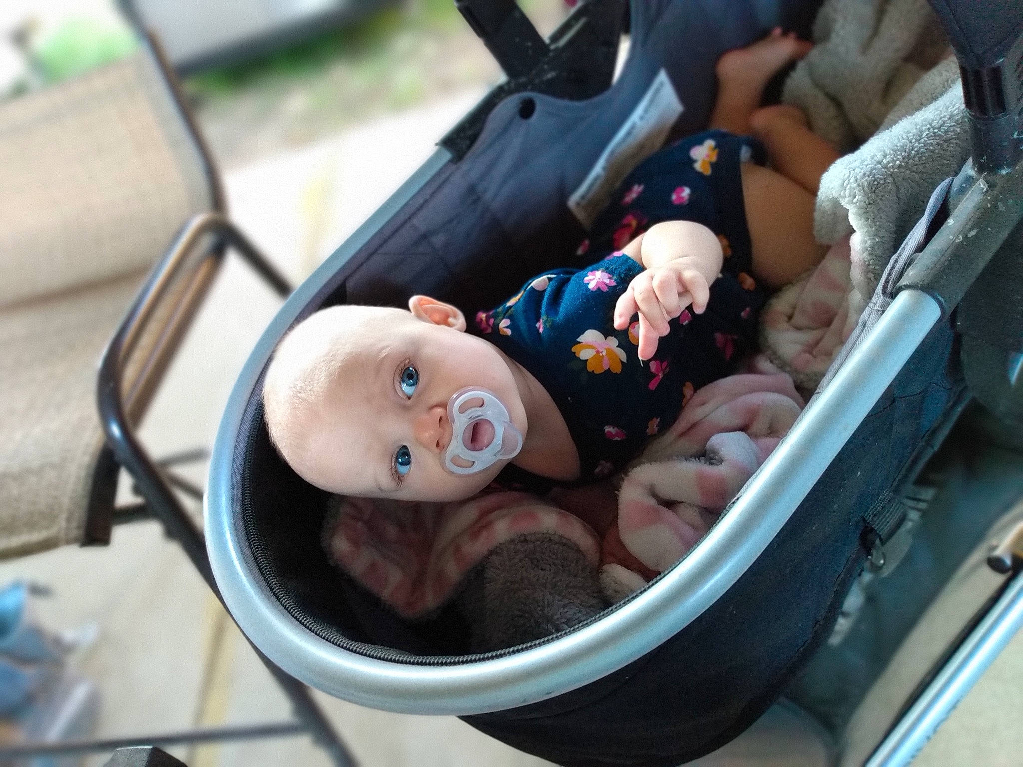 Scarlett is registered to the contest to win money with this photo: auto_part, automotive_design, automotive_exterior, baby, baby_carriage, car, car_seat, chair, comfort, fun, hand, motor_vehicle, person, skin, smile, tire, toddler, vehicle, vehicle_door, wheel