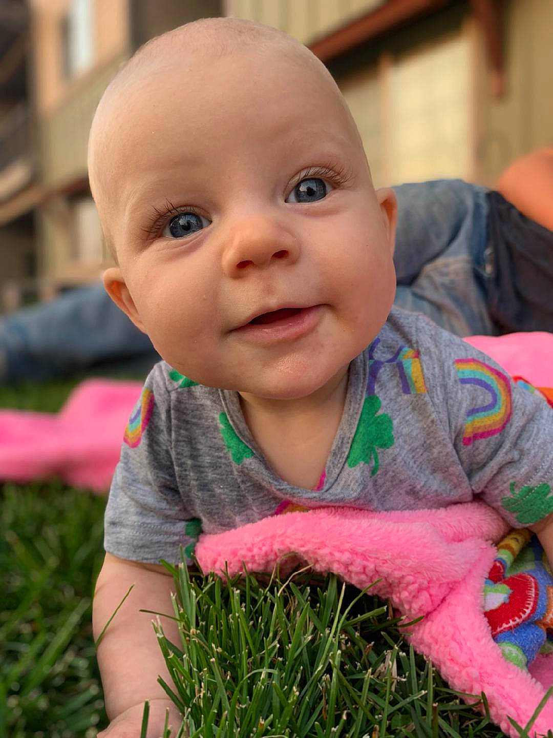 Scarlett is registered to the contest to win money with this photo: baby, baby_toddler_clothing, cheek, chin, eye, face, facial_expression, gesture, grass, happy, iris, leaf, lip, mammal, nose, organ, people_in_nature, person, plant, skin