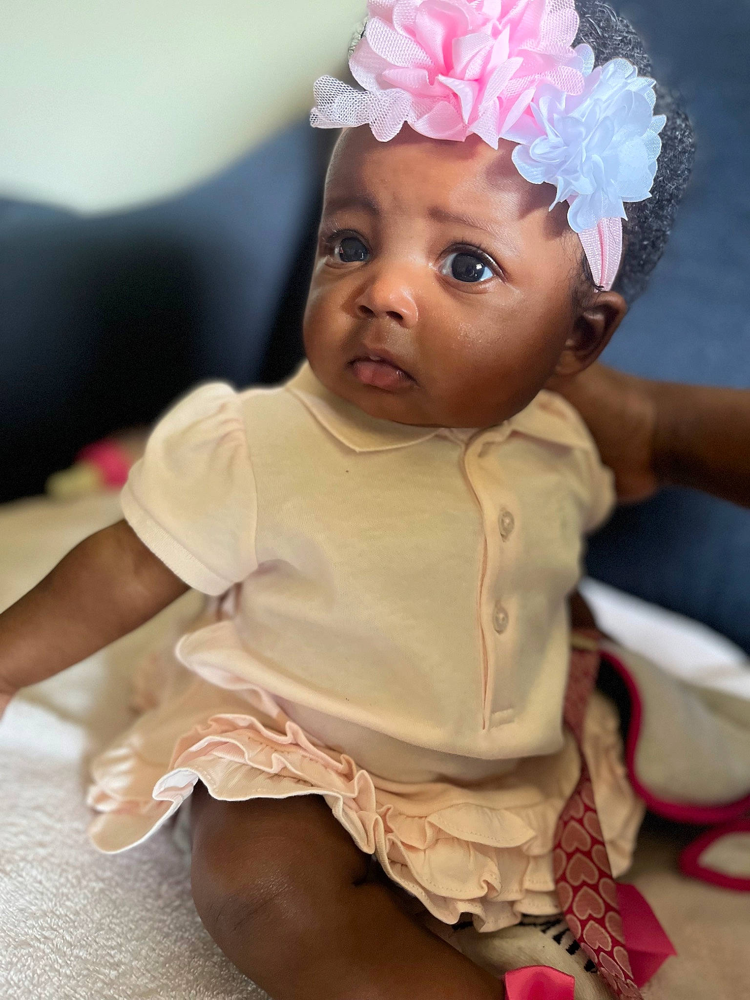 Ameiah is registered to the contest to win money with this photo: baby, baby_toddler_clothing, cheek, child, chin, dress, eyelash, face, finger, happy, head, headband, headpiece, headwear, iris, lip, person, petal, pink, skin