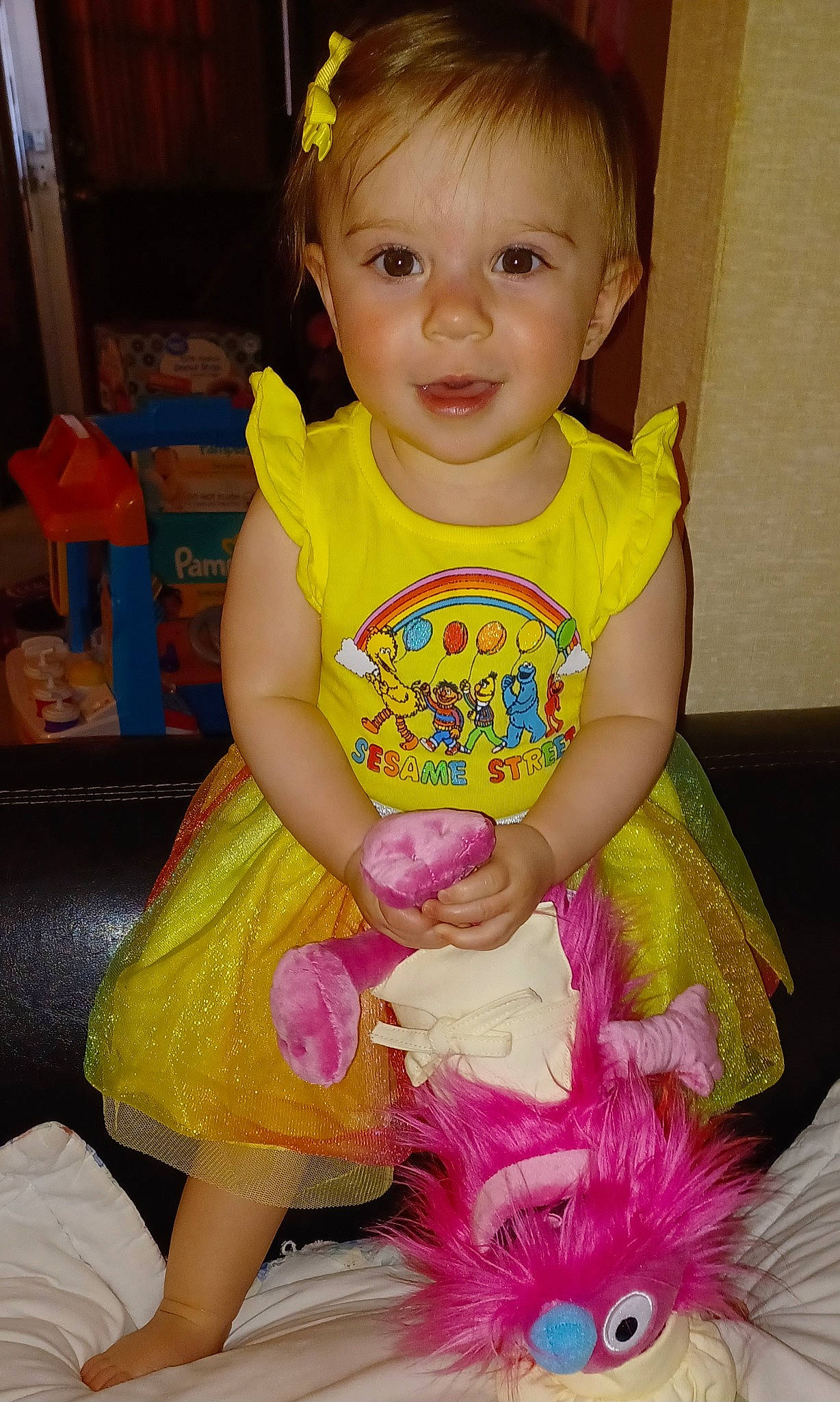 Natalie is registered to the contest to win money with this photo: baby_toddler_clothing, ballet_tutu, chair, cheek, child, clothing, day_dress, embellishment, eyelash, fun, happy, iris, magenta, organ, person, pink, sitting, skin, sleeve, toddler