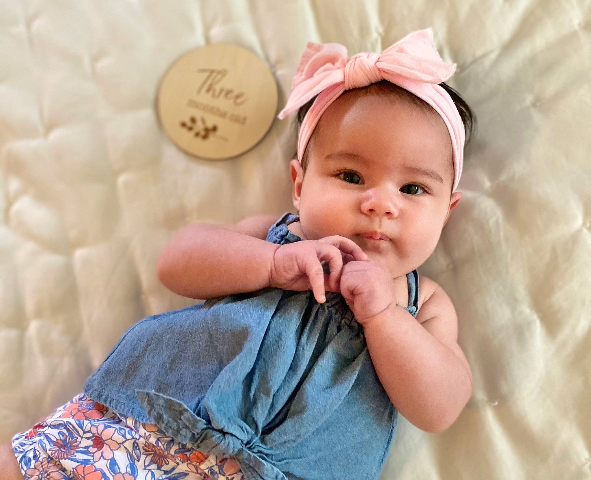 Meredith joined the competition — help win amazing prizes! baby, baby_toddler_clothing, cap, cheek, ear, face, facial_expression, finger, gesture, happy, head, headband, headgear, person, pink, product, skin, sleeve, smile, textile