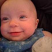 Paisley joined the competition — help win amazing prizes! baby, child, smiling, face, blue_clothing, tulle, chubby_cheeks, eyes, portrait, close_up, cute, infant, happy, skin, person, clothing, fabric, texture, indoor, head