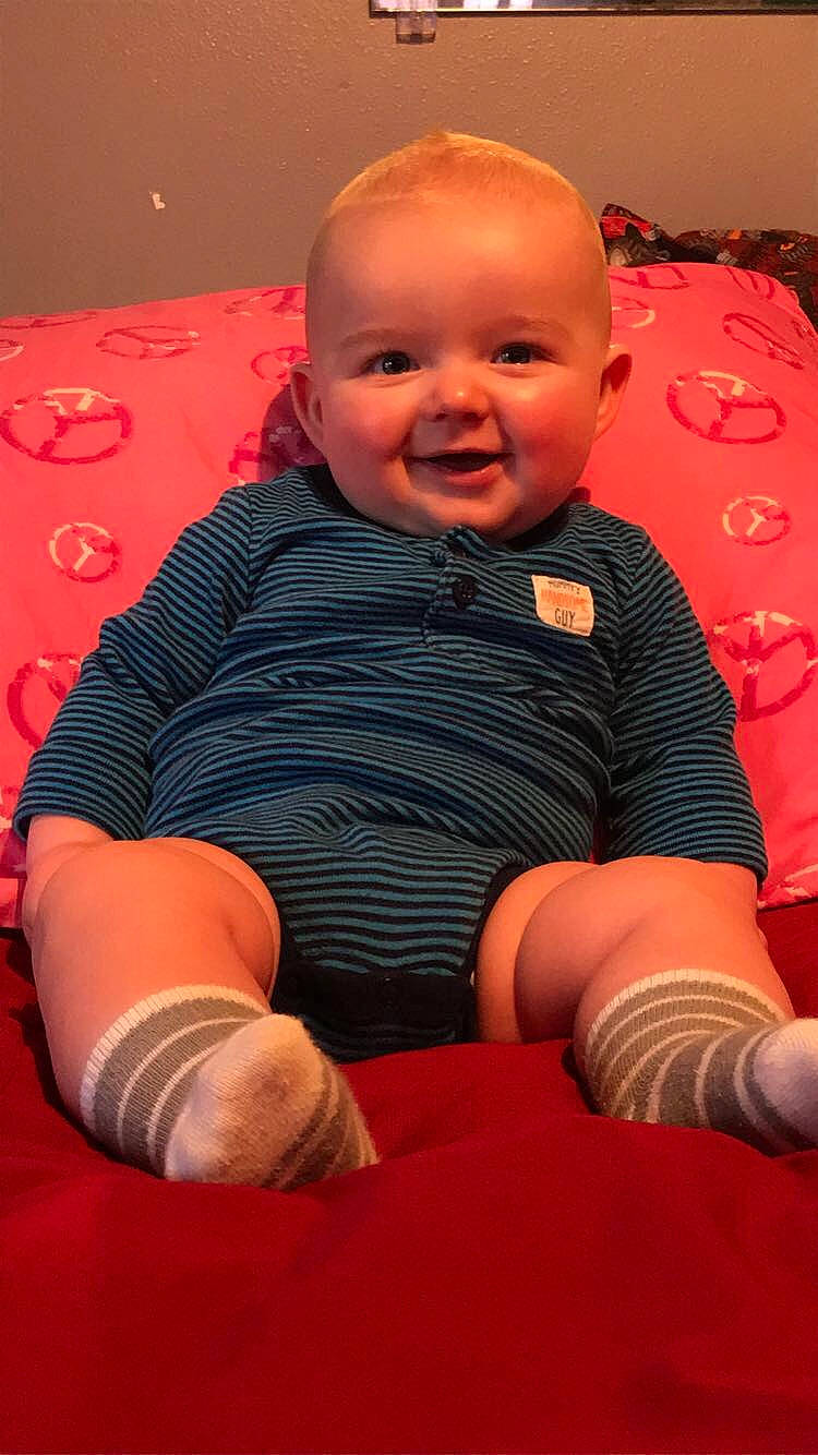 Ian joined the competition — help win amazing prizes! arm, baby, baby_toddler_clothing, cheek, chin, comfort, facial_expression, finger, head, joint, knee, leg, mouth, orange, person, pink, skin, sleeve, smile, standing