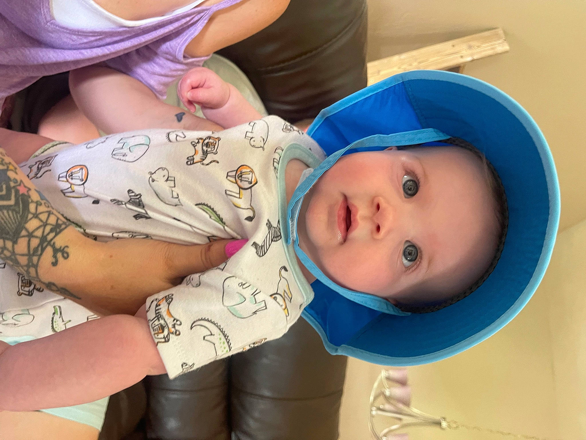 Beckham is registered to the contest to win money with this photo: arm, baby, baby_products, baby_toddler_clothing, cheek, chest, child, elbow, eyelash, hand, happy, hat, headwear, human_leg, mouth, pattern, person, skin, temporary_tattoo, thigh