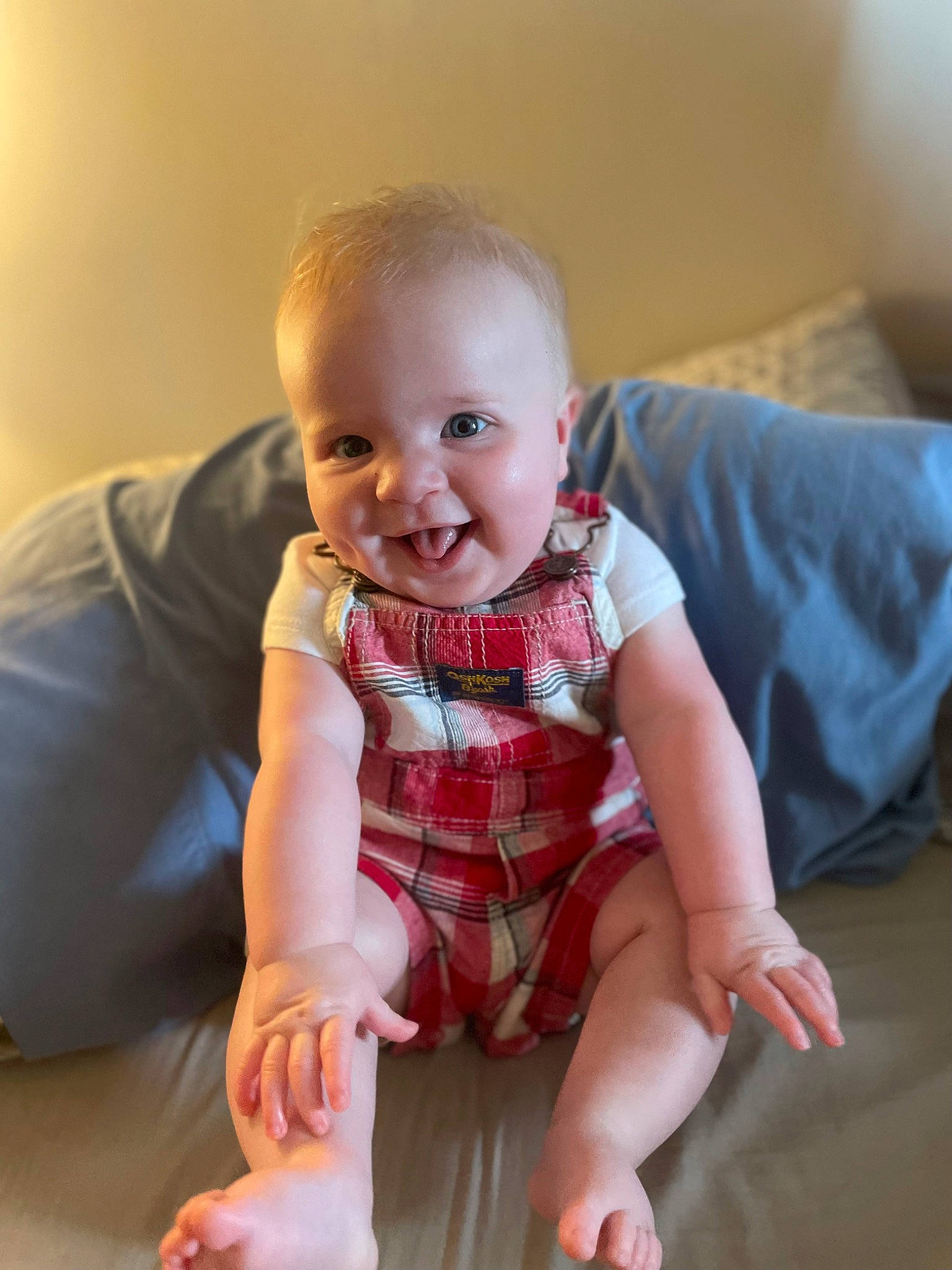 Beckham is registered to the contest to win money with this photo: baby, baby_toddler_clothing, cheek, child, comfort, finger, floor, flooring, happy, human_leg, iris, joint, joy, pattern, person, product, skin, sleeve, smile, standing