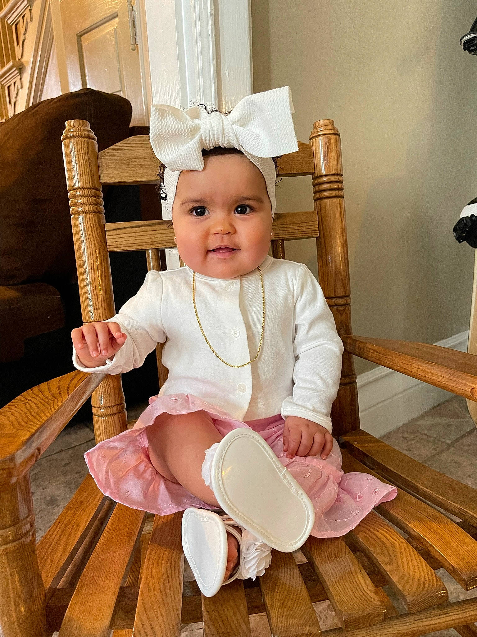 Milani joined the competition — help win amazing prizes! baby, baby_toddler_clothing, beauty, chair, child, comfort, floor, flooring, hardwood, headwear, human_body, knee, person, product, sitting, skin, sleeve, sock, textile, thigh