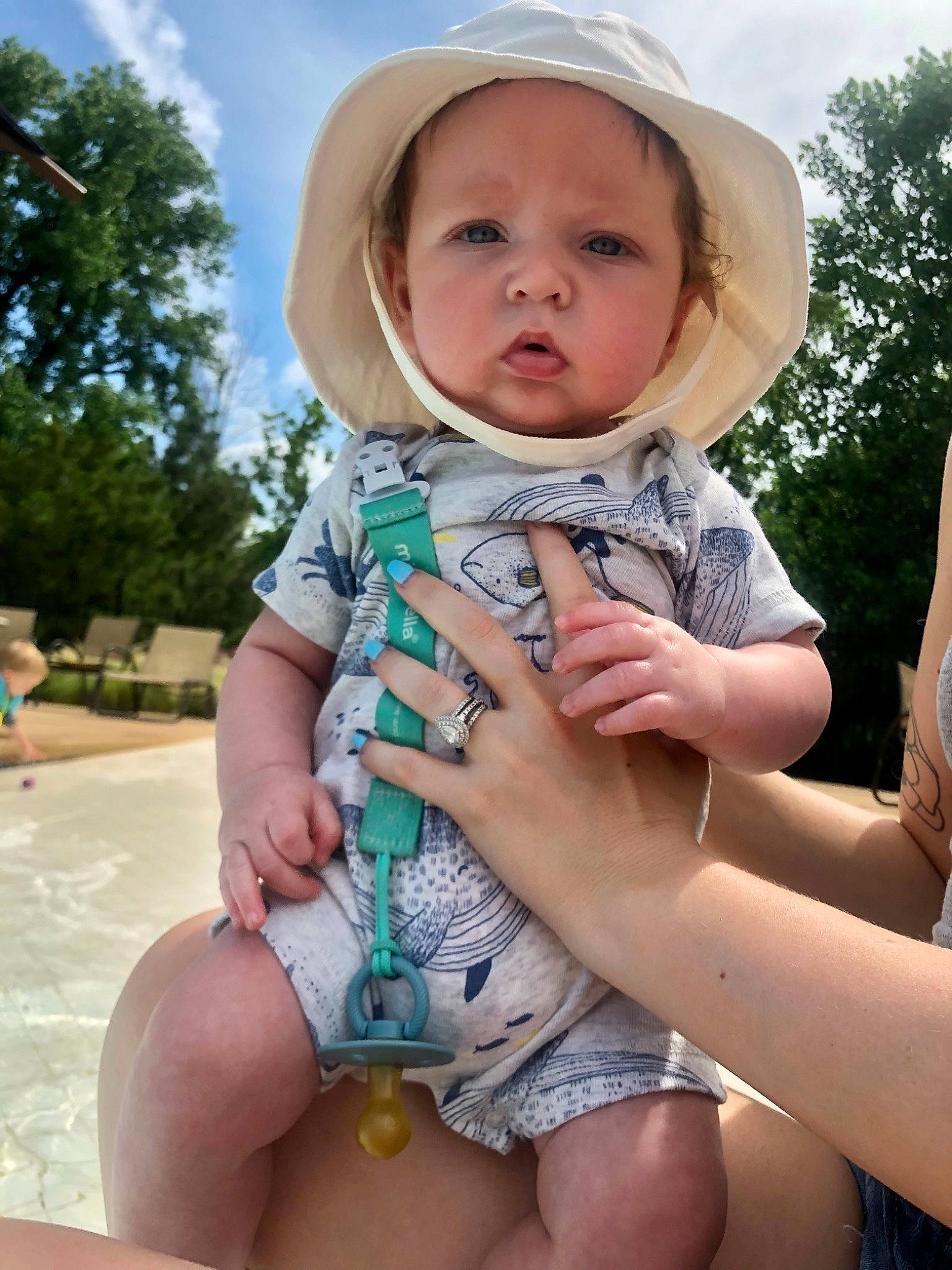 Case is registered to the contest to win money with this photo: azure, baby, baby_toddler_clothing, cloud, finger, fun, gesture, grass, happy, hat, headwear, leg, leisure, person, plant, skin, sky, sun_hat, thigh, thumb