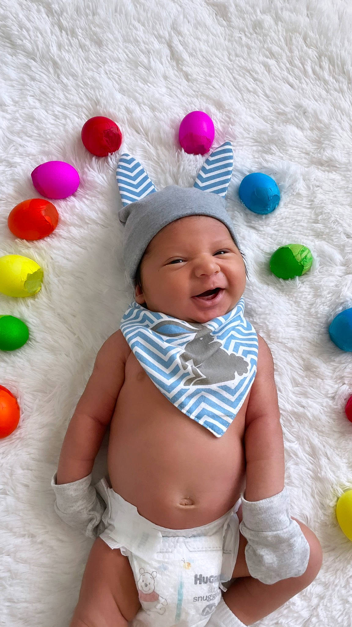 Leónel is registered to the contest to win money with this photo: abdomen, baby, baby_playing_with_toys, baby_products, baby_toddler_clothing, cheek, child, diaper, face, facial_expression, fun, happy, headwear, party_supply, person, pink, skin, smile, stomach, textile