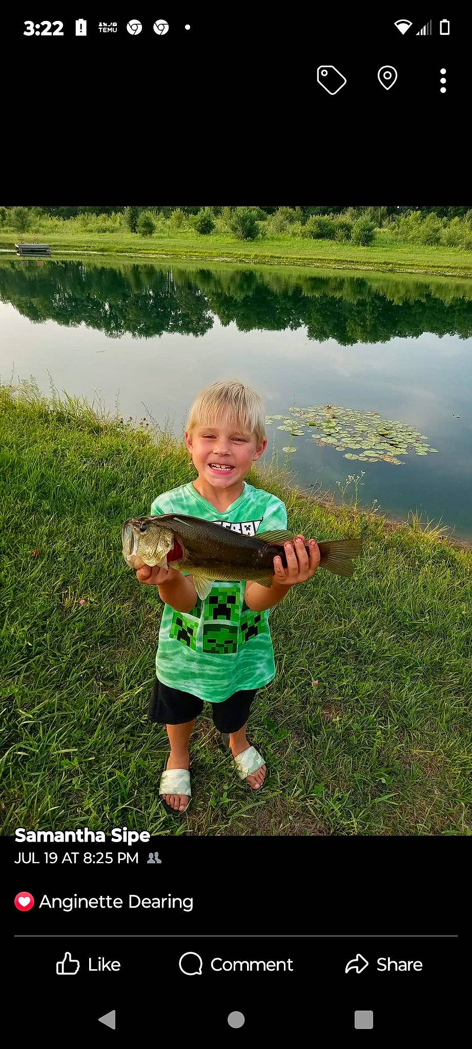 Remington is registered to the contest to win money with this photo: fun, grass, grass_family, grassland, happy, joy, lacustrine_plain, lake, landscape, lawn, leisure, meadow, natural_environment, people_in_nature, person, plant, recreation, shorts, sleeve, smile