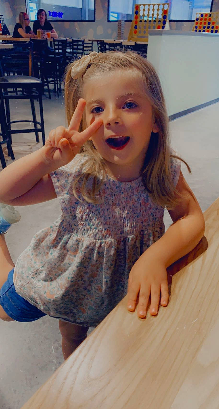 Kora joined the competition — help win amazing prizes! arm, chair, chin, dress, facial_expression, gesture, hair, hairstyle, happy, human, iris, joint, lip, mouth, neck, person, shoulder, skin, sleeve, smile