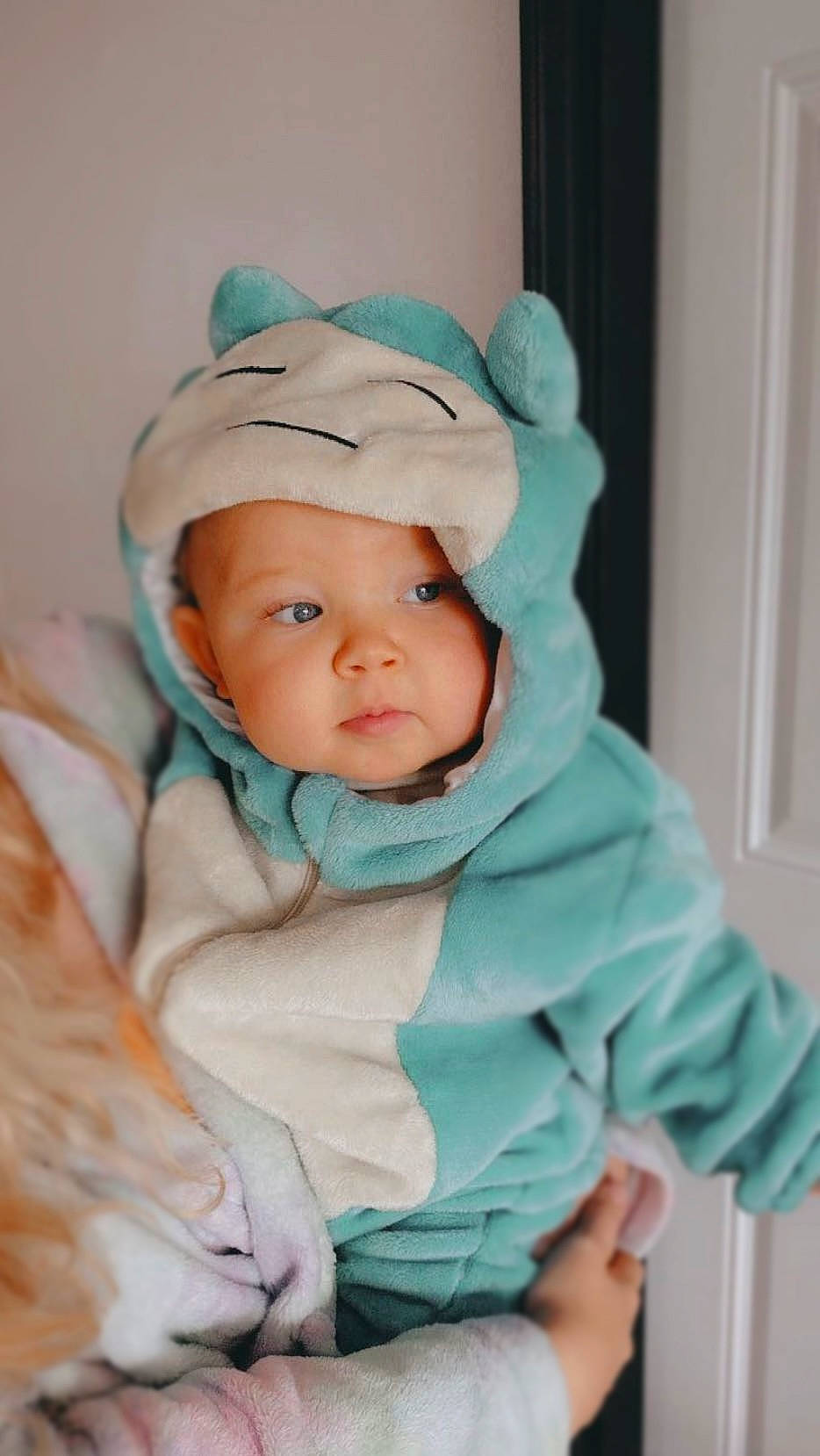 Ryleigh joined the competition — help win amazing prizes! baby, baby_products, baby_toddler_clothing, beanie, cap, cheek, child, comfort, door, eye, face, fashion_accessory, fur, happy, headgear, headwear, linens, outerwear, person, sitting