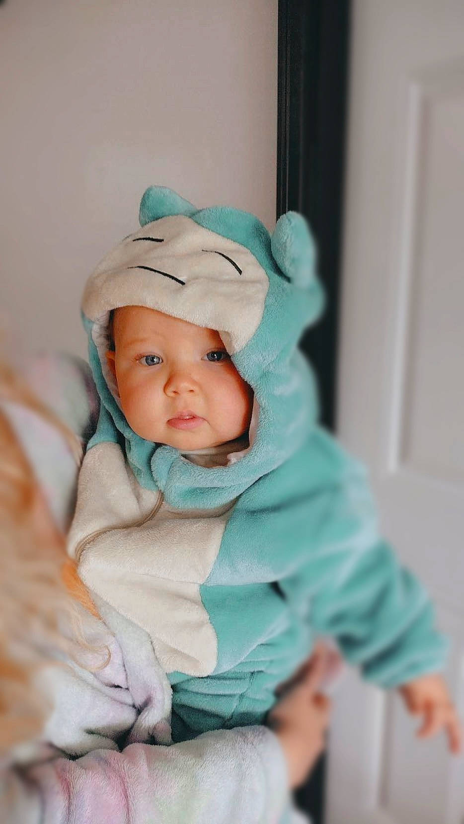 Ryleigh is registered to the contest to win money with this photo: baby, baby_products, baby_toddler_clothing, beanie, cap, cheek, child, comfort, door, eye, fashion_accessory, fun, fur, grass, happy, head, headwear, person, portrait_photography, sitting