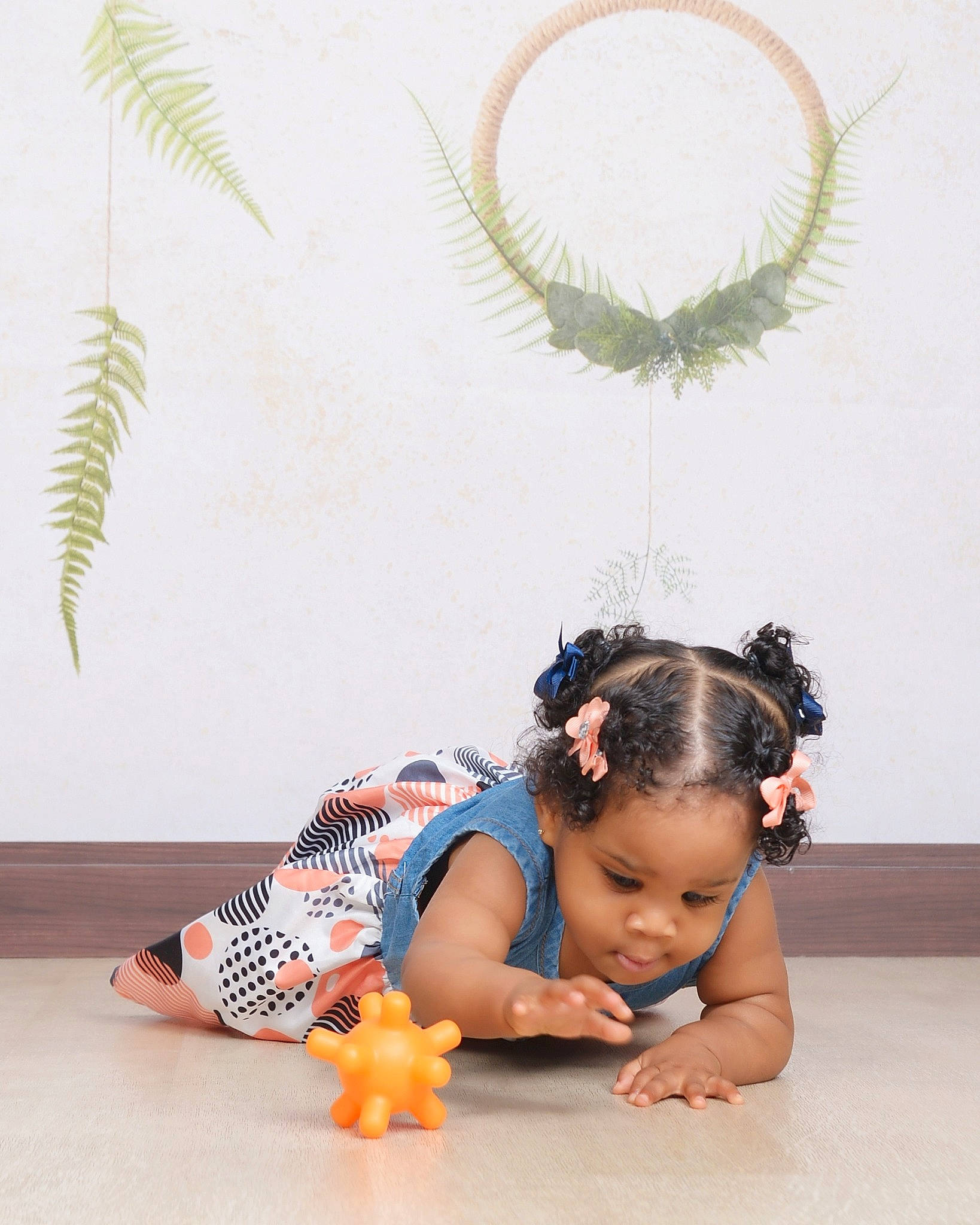 Ariyah is registered to the contest to win money with this photo: barefoot, fashion_accessory, flooring, foot, fun, happy, headpiece, human_leg, jewellery, knee, leisure, neck, pattern, person, plant, sitting, thigh, toddler, trunk, white