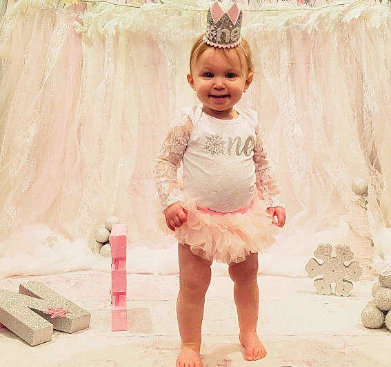 Chelsea joined the competition — help win amazing prizes! baby, baby_products, baby_toddler_clothing, ballet_tutu, child, child_model, clothing, costume, dress, embellishment, fashion_accessory, hair_accessory, headgear, headpiece, joy, lace, person, pink, product, ruffle