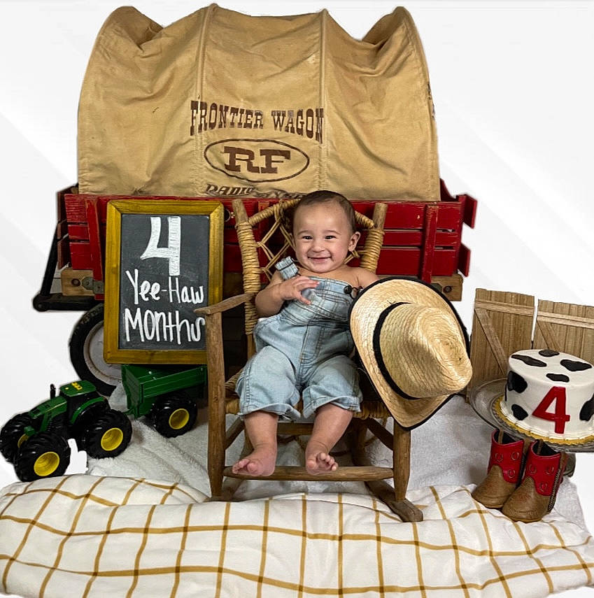 Aj is registered to the contest to win money with this photo: baby, baby_products, baby_toddler_clothing, cart, child, font, hat, jersey, joy, mammal, person, product, shorts, sleeve, smile, sun_hat, t_shirt, tire, toddler, toy