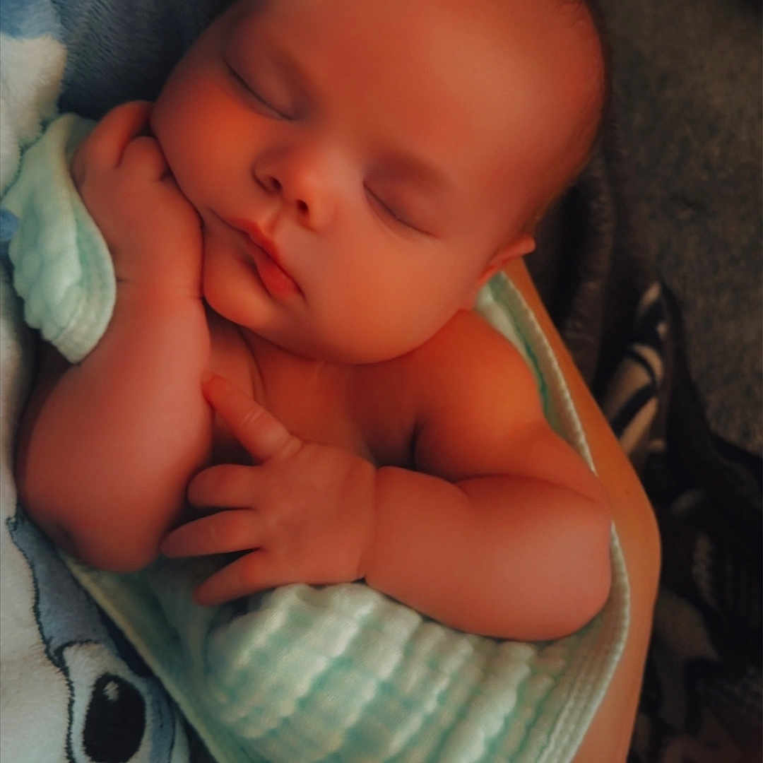 Andora is registered to the contest to win money with this photo: baby, blanket, child, comfort, cozy, cute, face, hand, indoor, infant, newborn, peaceful, portrait, rest, skin, sleeping, soft, toddler, warm, wrapped