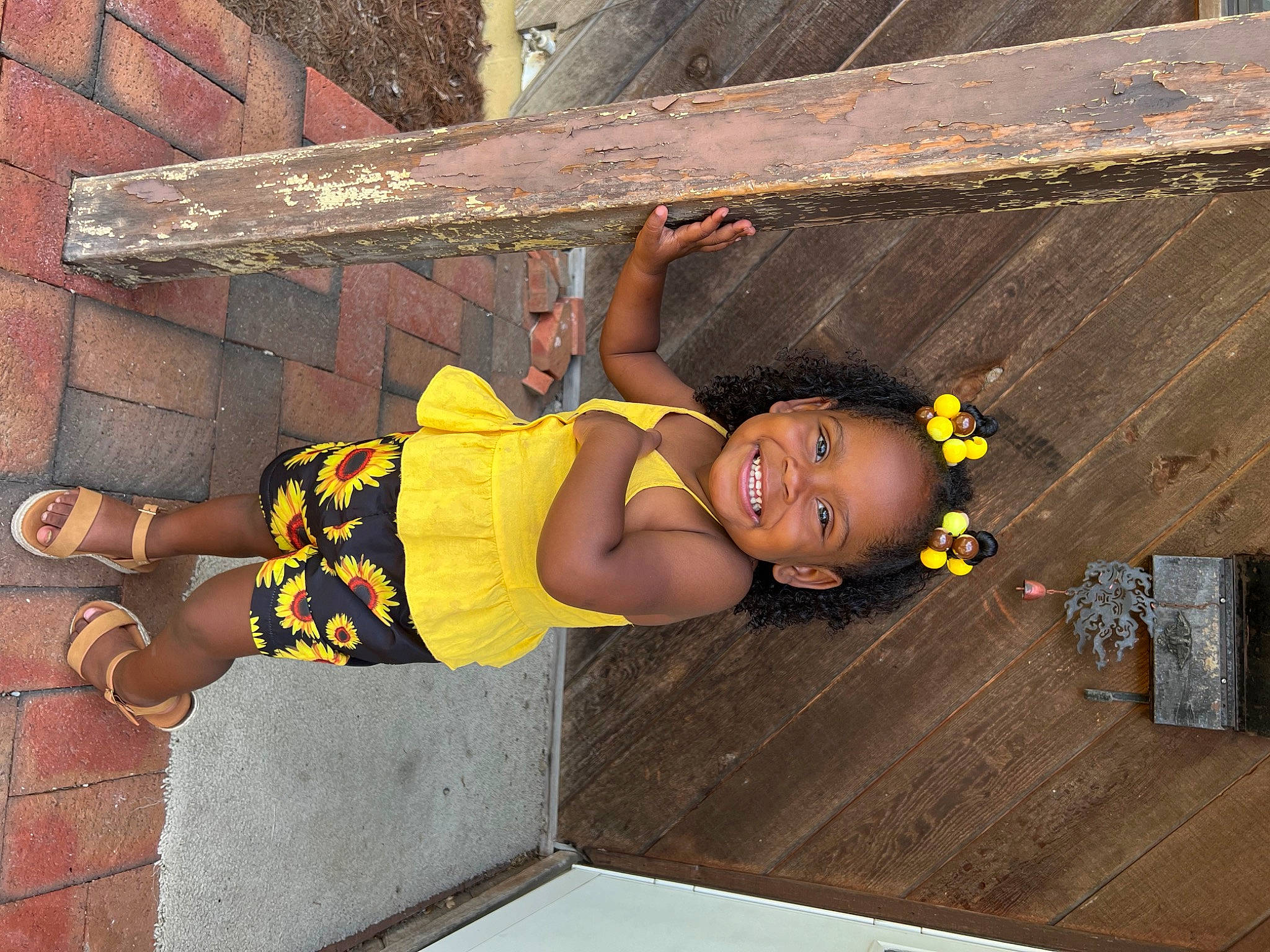 Zoella joined the competition — help win amazing prizes! baby_toddler_clothing, brick, child, fun, happy, joy, leisure, person, sandal, smile, t_shirt, thigh, toddler, tree, wood