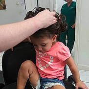 Nevaeh is registered to the contest to win money with this photo: adult, baby, chair, clothing, couch, cushion, door, face, female, furniture, hair, head, homedecor, pants, person, photography, portrait, shorts, t_shirt, woman