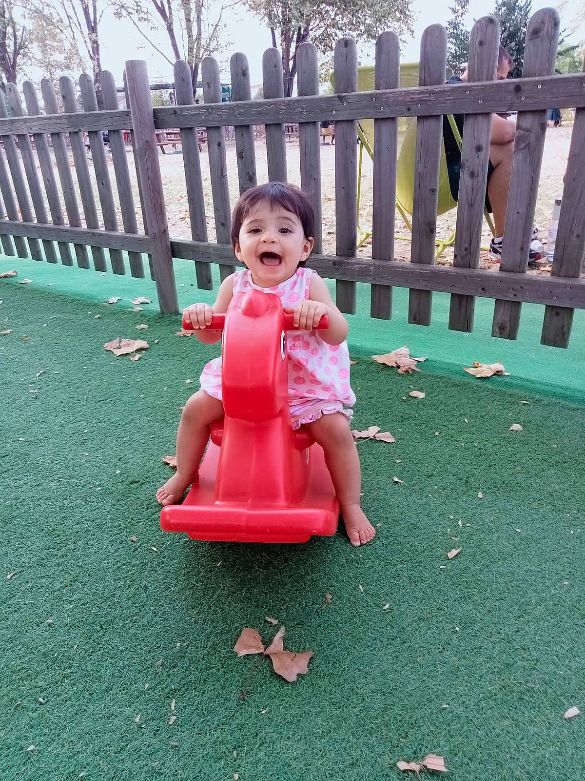 Farah participe au concours pour gagner de l'argent avec cette photo : baby_toddler_clothing, carmine, child, chute, city, dress, fence, fun, grass, happy, leisure, magenta, outdoor_play_equipment, person, playground, recreation, sitting, sky, toddler, toy